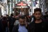 A tram moves along the crowded Istiklal Street in the Beyoglu district of Istanbul.