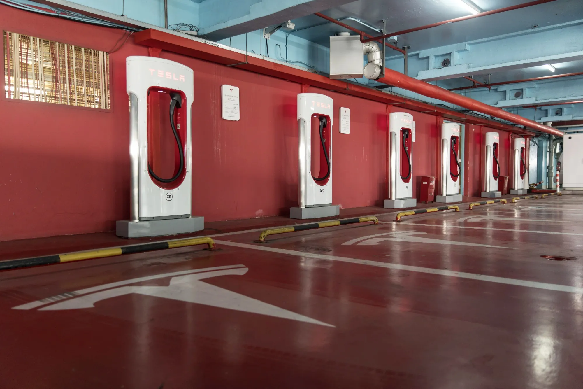 Tesla Supercharger station at a parking garage in Shanghai.