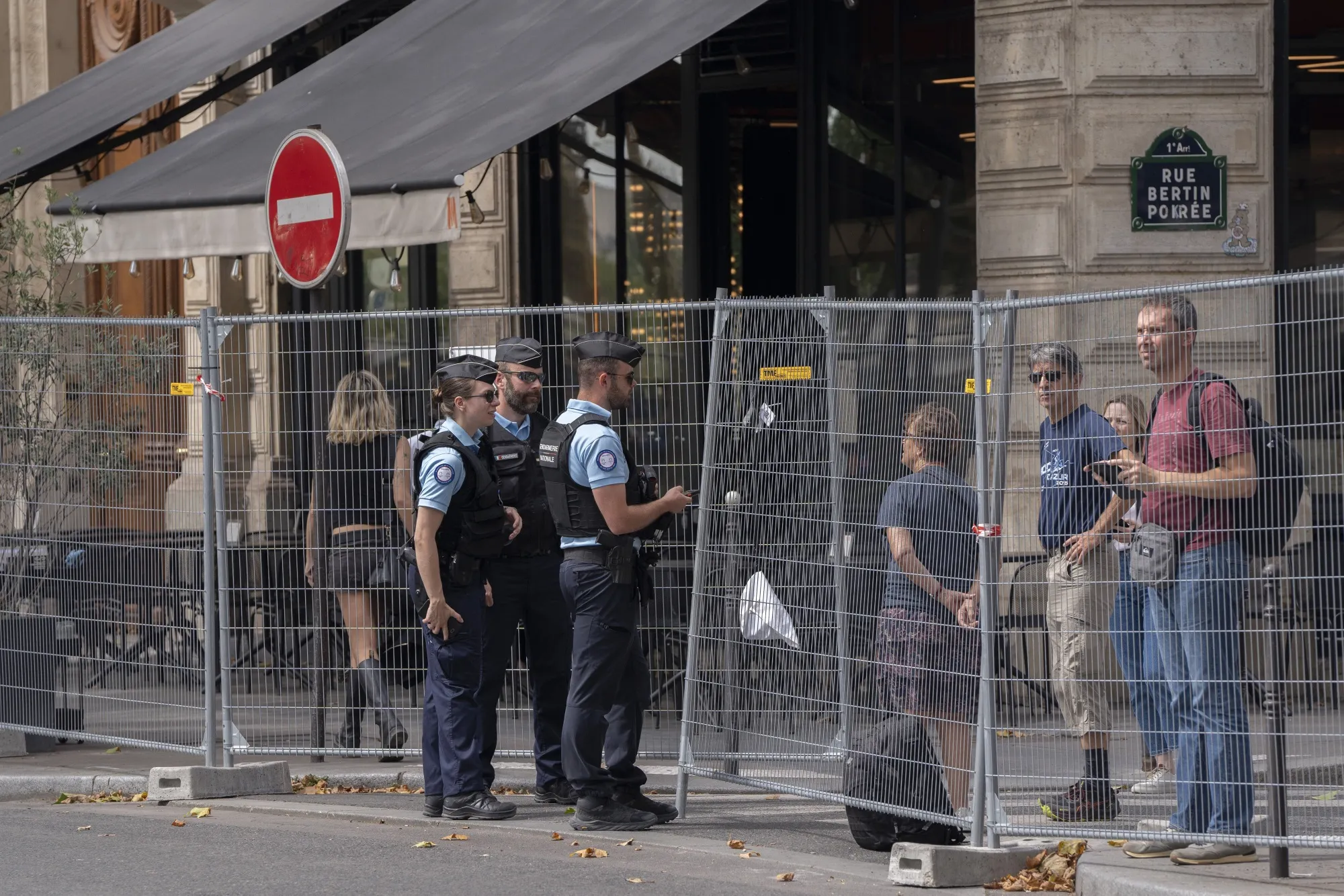 Security fencing cuts through the middle of the city.