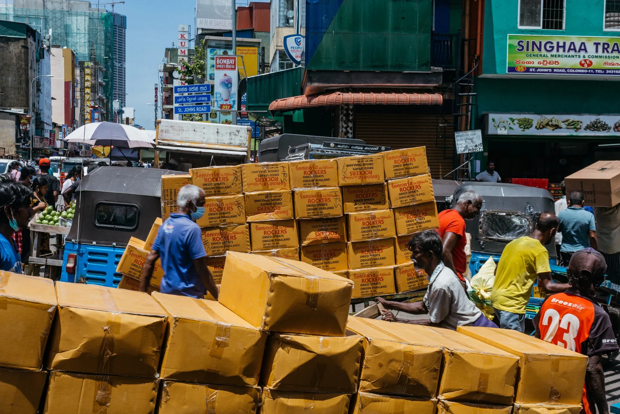 Workers transport products to a warehouse in Colombo, Sri Lanka.