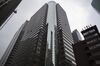 The American International Group Inc. (AIG) headquarters office stands in New York, U.S., on Tuesday, Jan. 29, 2016. American International Group Inc., the insurer being pressured by activist investor Carl Icahn to divest assets, had the outlook on its credit rating changed to negative from stable by Standard & Poor's after announcing plans to sell a stake in mortgage insurer United Guaranty Corp.