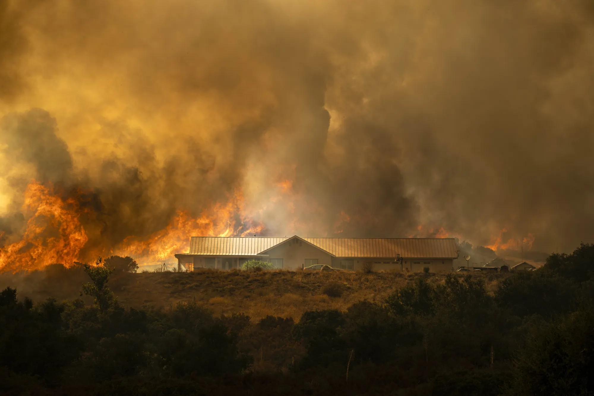A Lake Elsinore, California, house in the path of the Airport Fire.&nbsp;The fire is now 19,000 acres and has forced evacuations to Lake Elsinore residents.&nbsp;