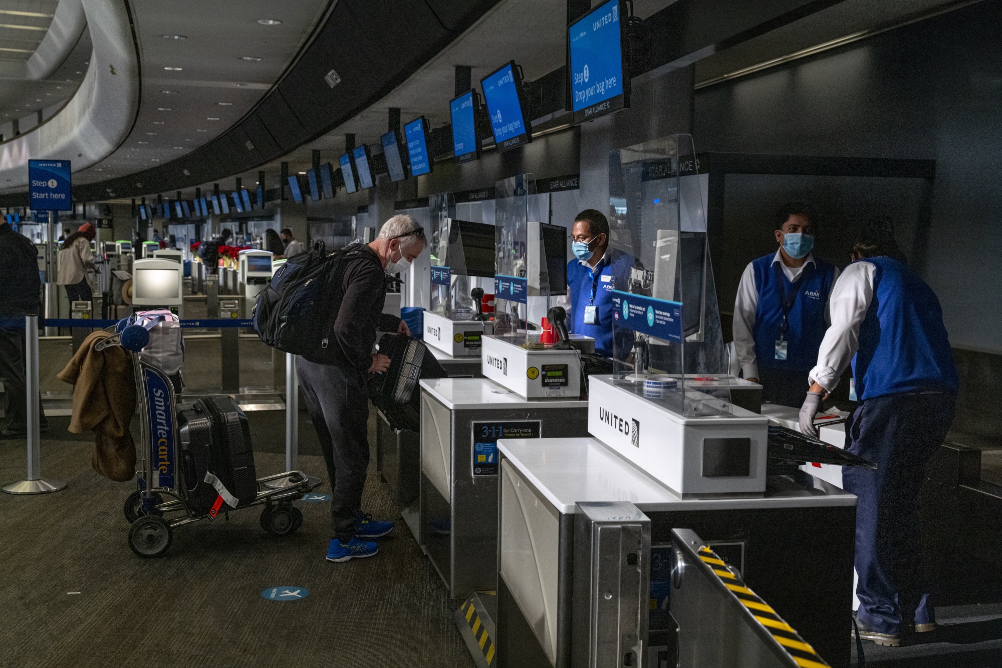 Travelers at SFO Airport before Christmas vacation