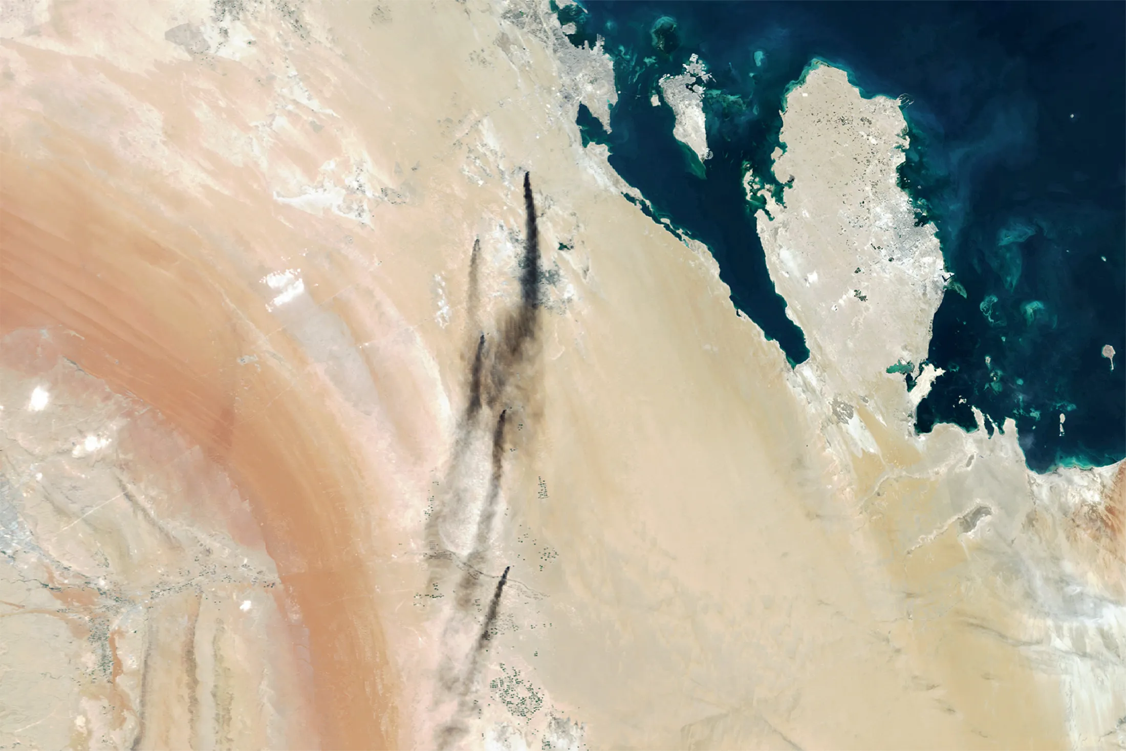 A satellite image&nbsp;shows smoke billowing&nbsp;from Saudi Aramco's oil processing plants in Abqaiq and Khurais, Saudi Arabia on Sept. 14.&nbsp;