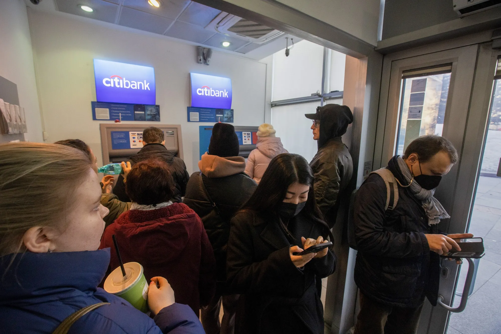 Long lines formed at ATM machines in Moscow.