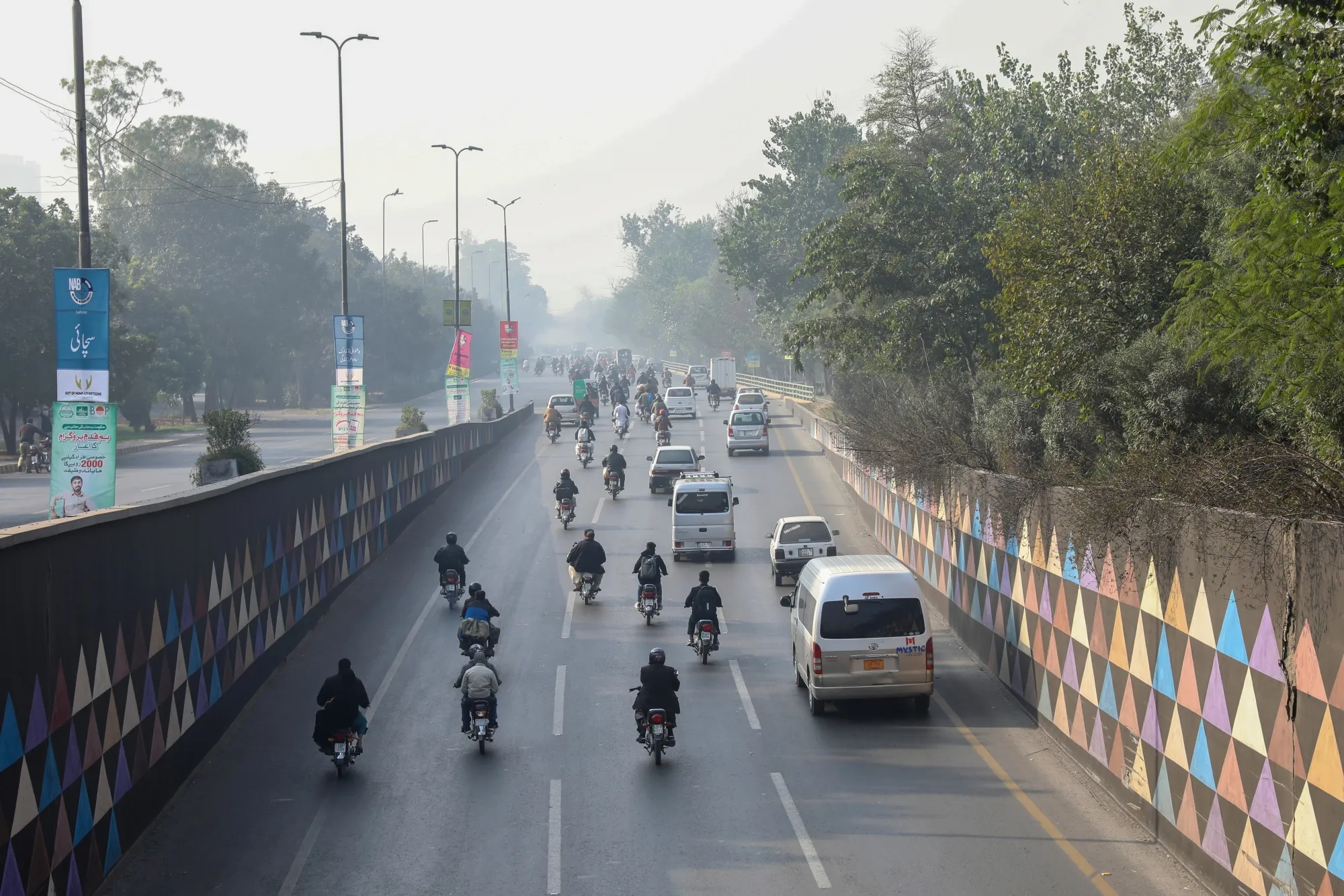 Traffic travels along a highway shrouded in smog in Lahore, Pakistan in December 2021. The city of more than 11 million people in Punjab province near the border with India consistently ranks among the worst cities in the world for air pollution.