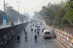 Traffic travels along a highway shrouded in smog in Lahore, Pakistan in December 2021. The city of more than 11 million people in Punjab province near the border with India consistently ranks among the worst cities in the world for air pollution.