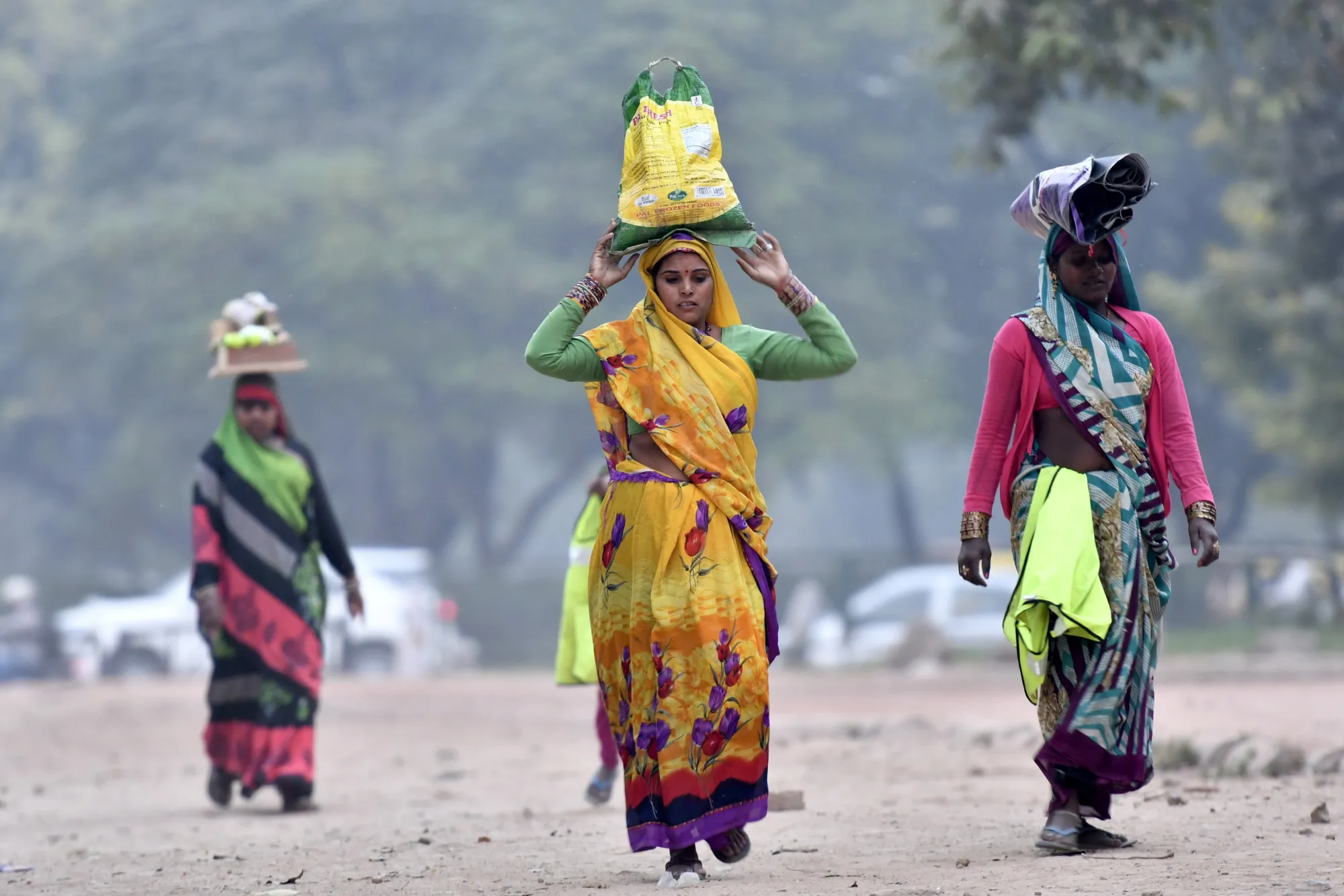 Women carry goods on their head in New Delhi, India, on&nbsp;Nov. 10.&nbsp;
