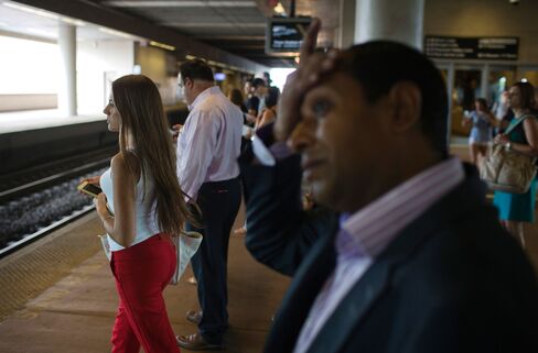 Commuters wait on a platform to board a New Jersey Transit train at the Frank R. Lautenberg Rail Station at Secaucus Junction in Secaucus, New Jersey, on Aug. 20, 2015.