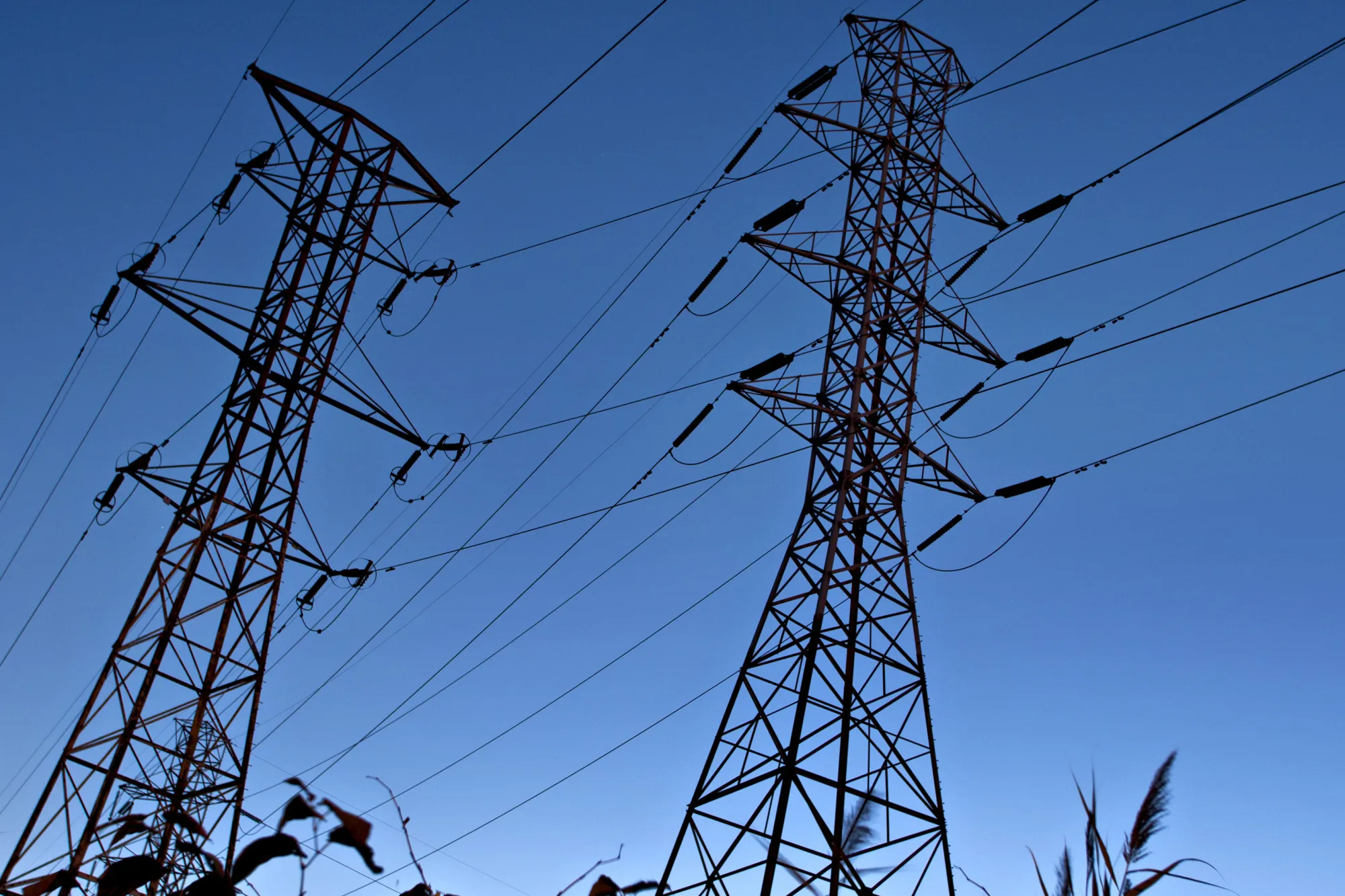 Power transmission lines are suspended from electricity pylons in Kearny, New Jersey, U.S.