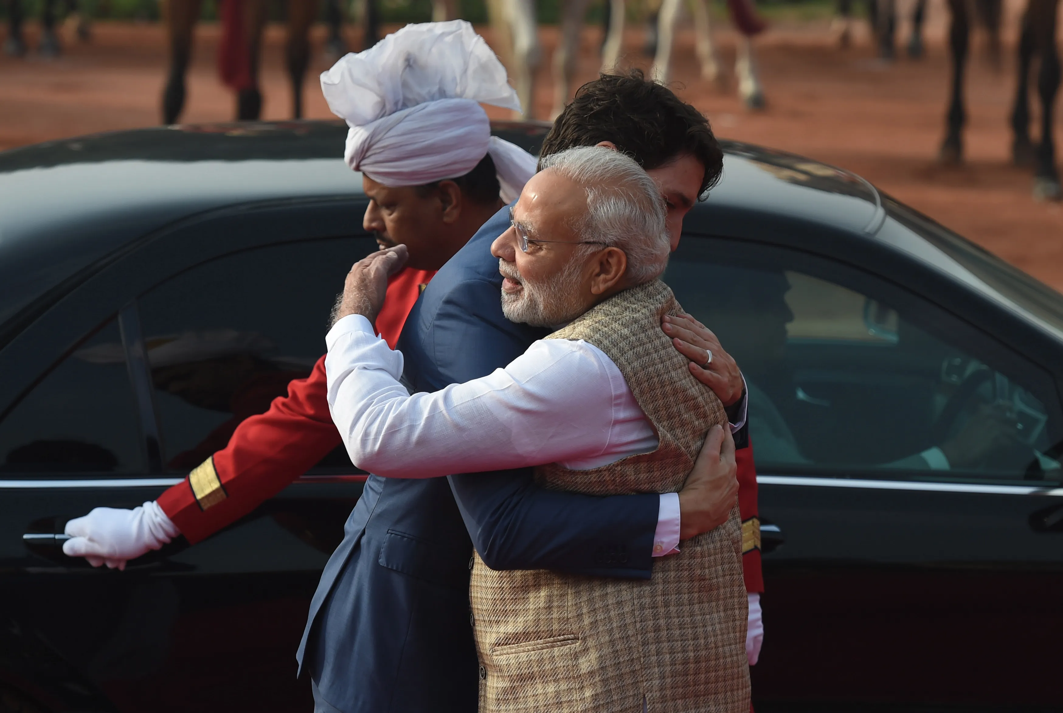 Narendra Modi embraces Justin Trudeau