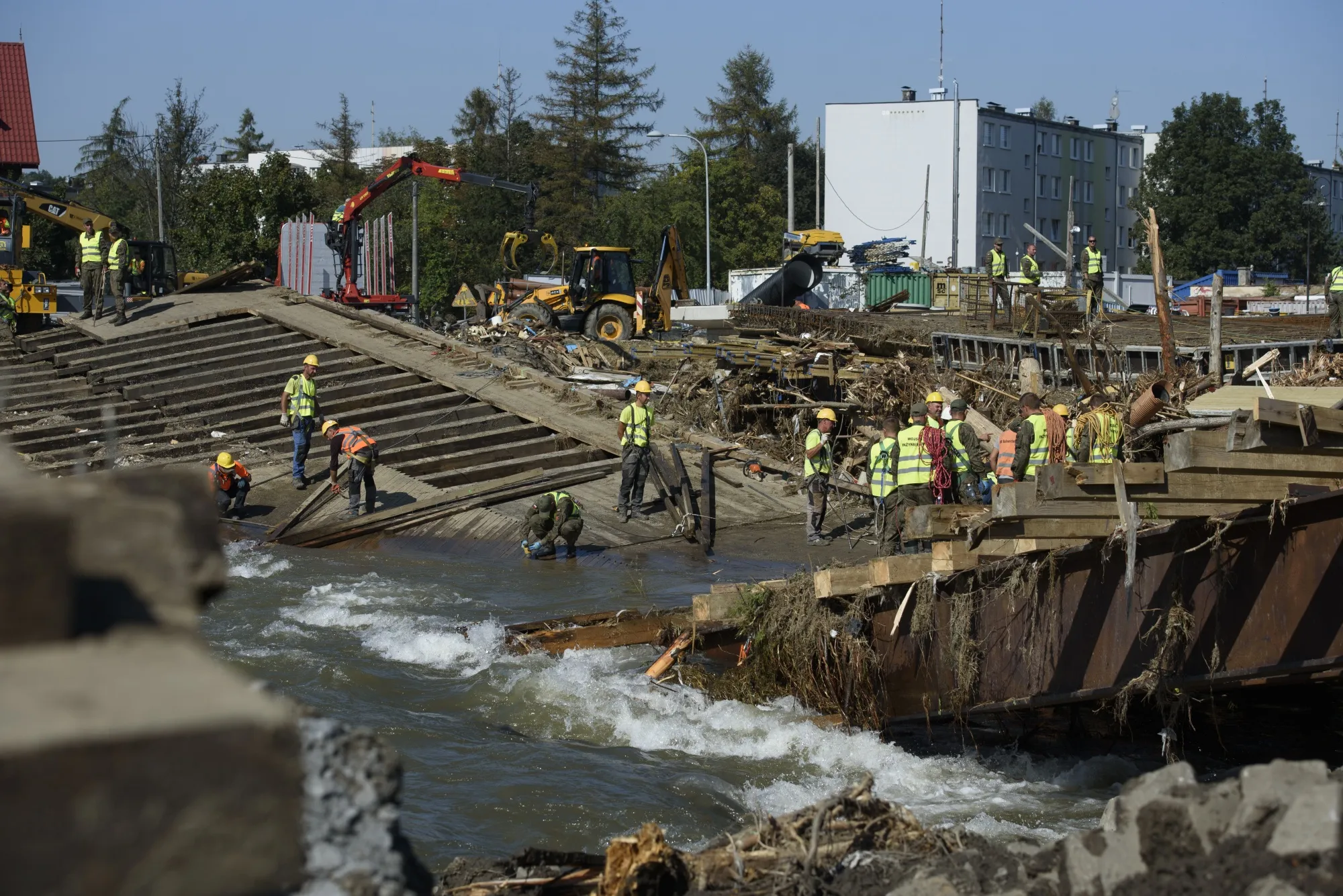 Polish armed forces and workers remove remnants of a bridge in the flood-hit town of Glucholazy, Poland, on Sept.&nbsp;20.