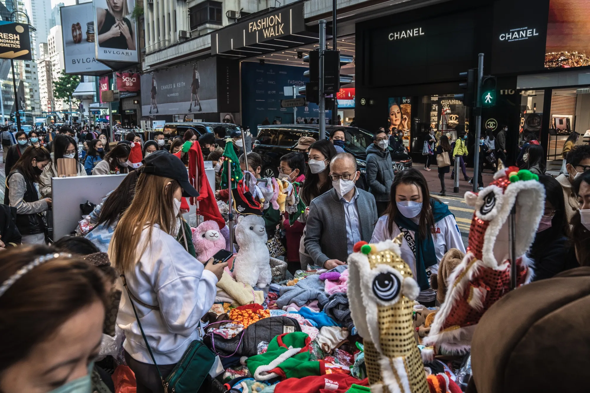 Shoppers browse products at a stall in Hong Kong, China, on Dec. 22