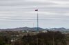A North Korean flag flying over North Korea's Gijungdong village is seen from the Daeseong-dong village in the Demilitarized Zone (DMZ) in Paju, South Korea,.