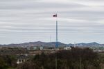 A North Korean flag flying over North Korea's Gijungdong village is seen from the Daeseong-dong village in the Demilitarized Zone (DMZ) in Paju, South Korea,.