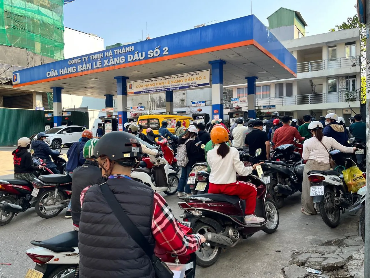 Motorists line up to refuel at a gas station in Hanoi on March 10.