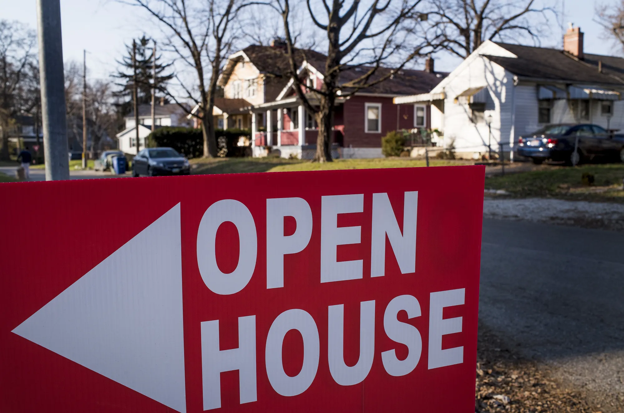 An "Open House" sign is displayed in the front yard of a home for sale in Columbus, Ohio, U.S.