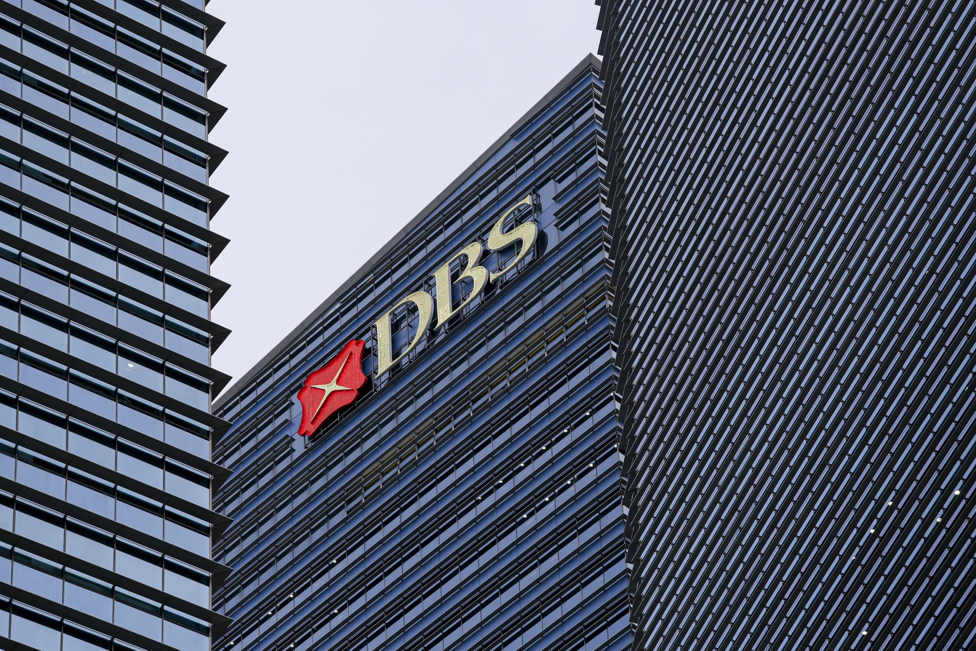 The DBS Group Holdings&nbsp;logo displayed atop Tower 3 of the Marina Bay Financial Centre in Singapore.