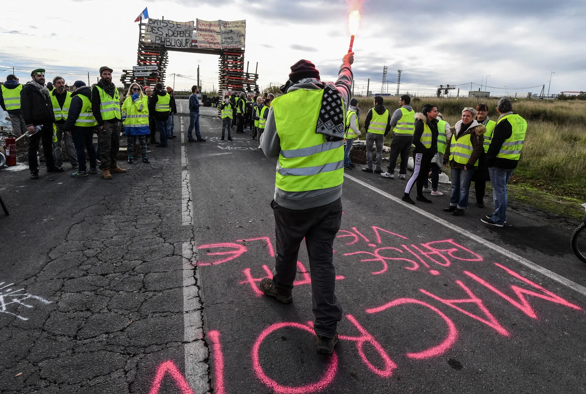 Protesters block the road leading to the Frontignan oil depot in the south of France, on Dec. 3.