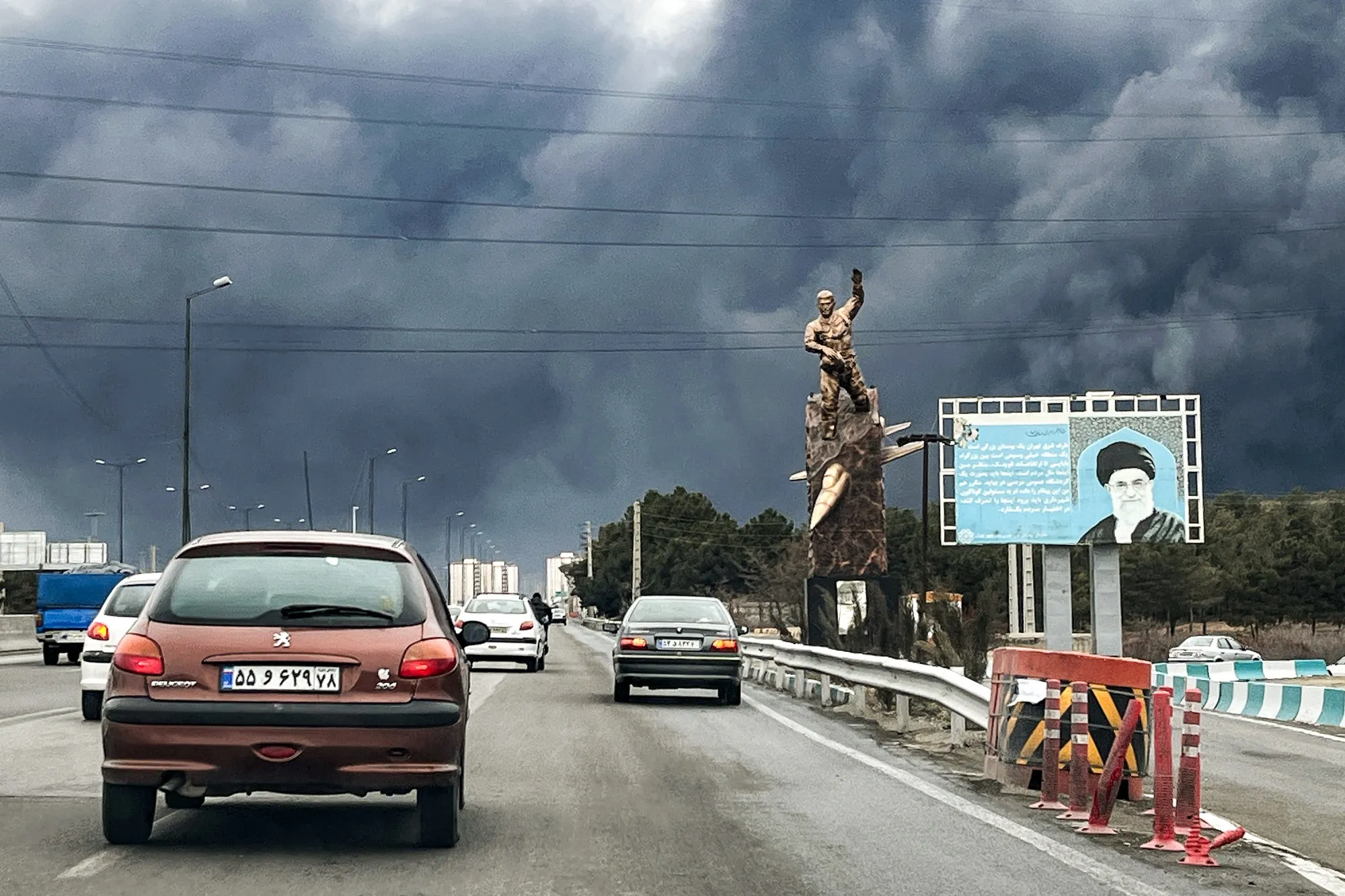 Vehicles move along a highway in Tehran on March 8, 2026.