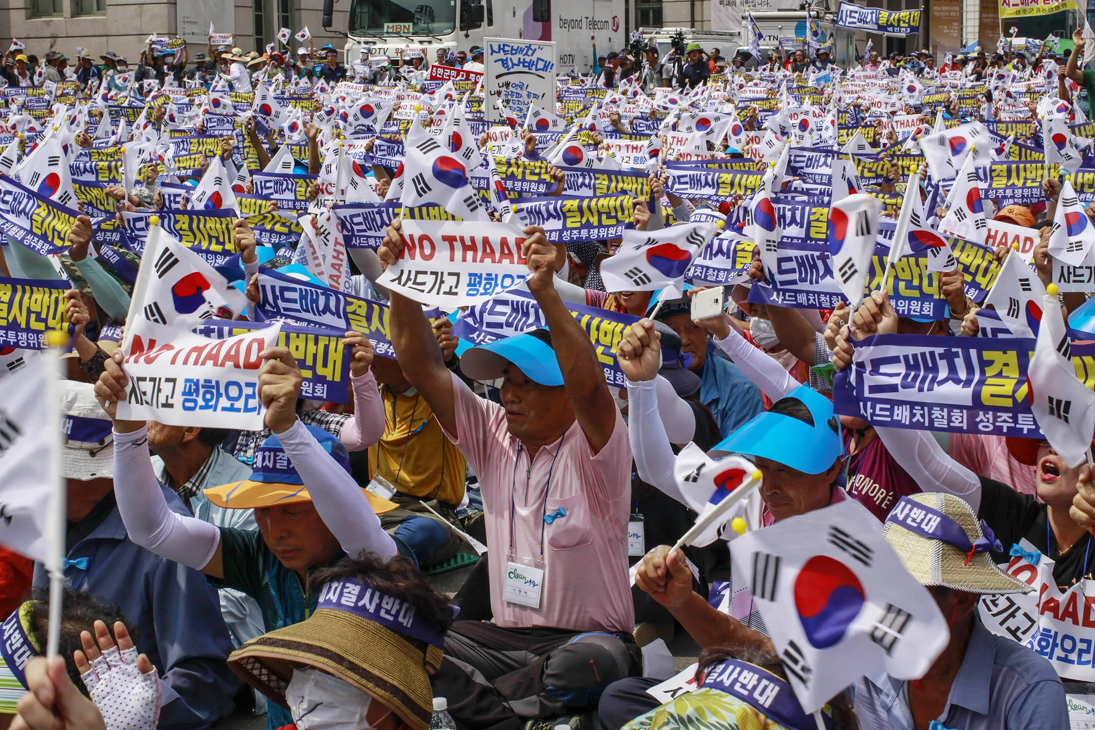 South Korean town residents shouts slogans protesting a plan to deploy an advanced U.S. missile defense system called Terminal High-Altitude Area Defense, or THAAD, in their neighborhood, in Seoul, South Korea. The missile system will be deployed in southeastern South Korea, Seoul officials announced Wednesday, July 13, angering not only North Korea and China but also local residents who fear potential health hazards they believe the U.S. system might cause. The letters read "Desperately oppose, Deployment THAAD."
