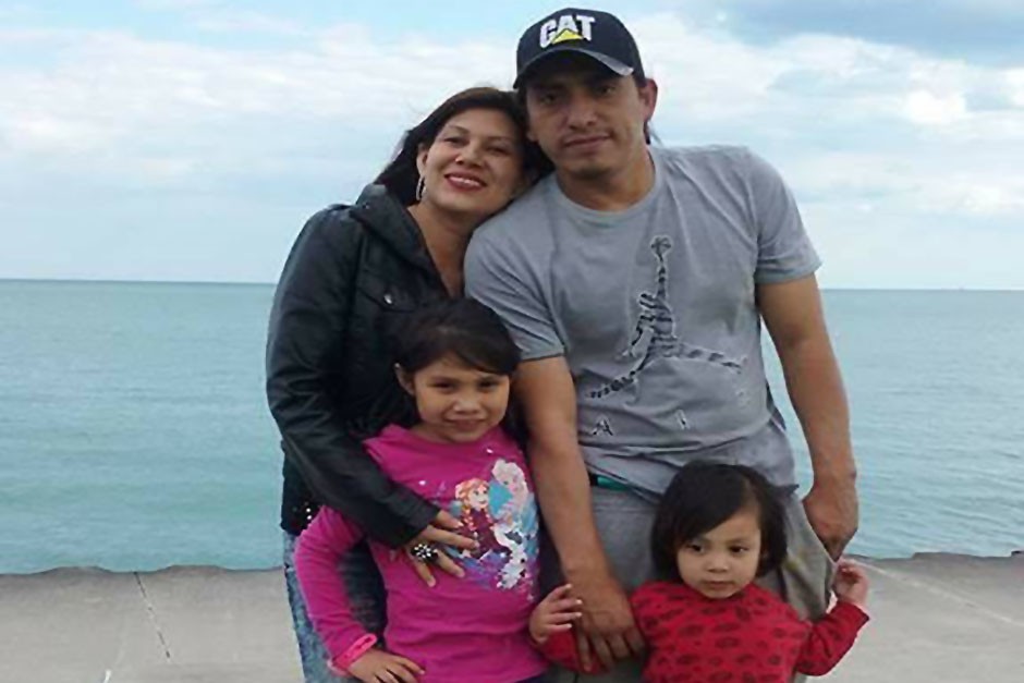 Wilmer Catalan-Ramirez, pictured here with his partner and kids, is facing deportation after he was labeled a gang member by Chicago police. 