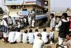 People waiting in line in January to get cash from a bank branch in Dhadgaon, India.
