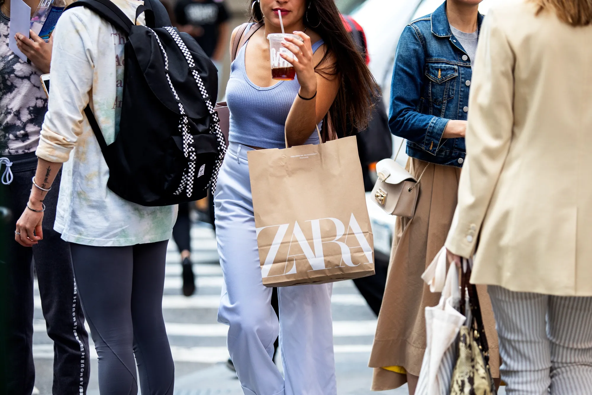 A pedestrian carries a Zara shopping bag in New York.