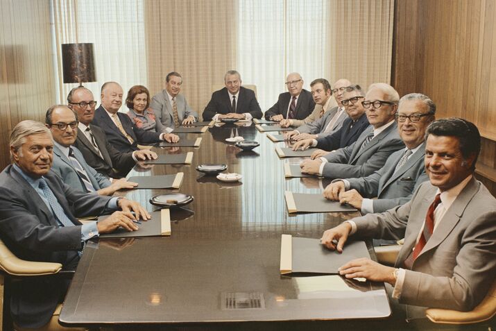 People sitting in conference room