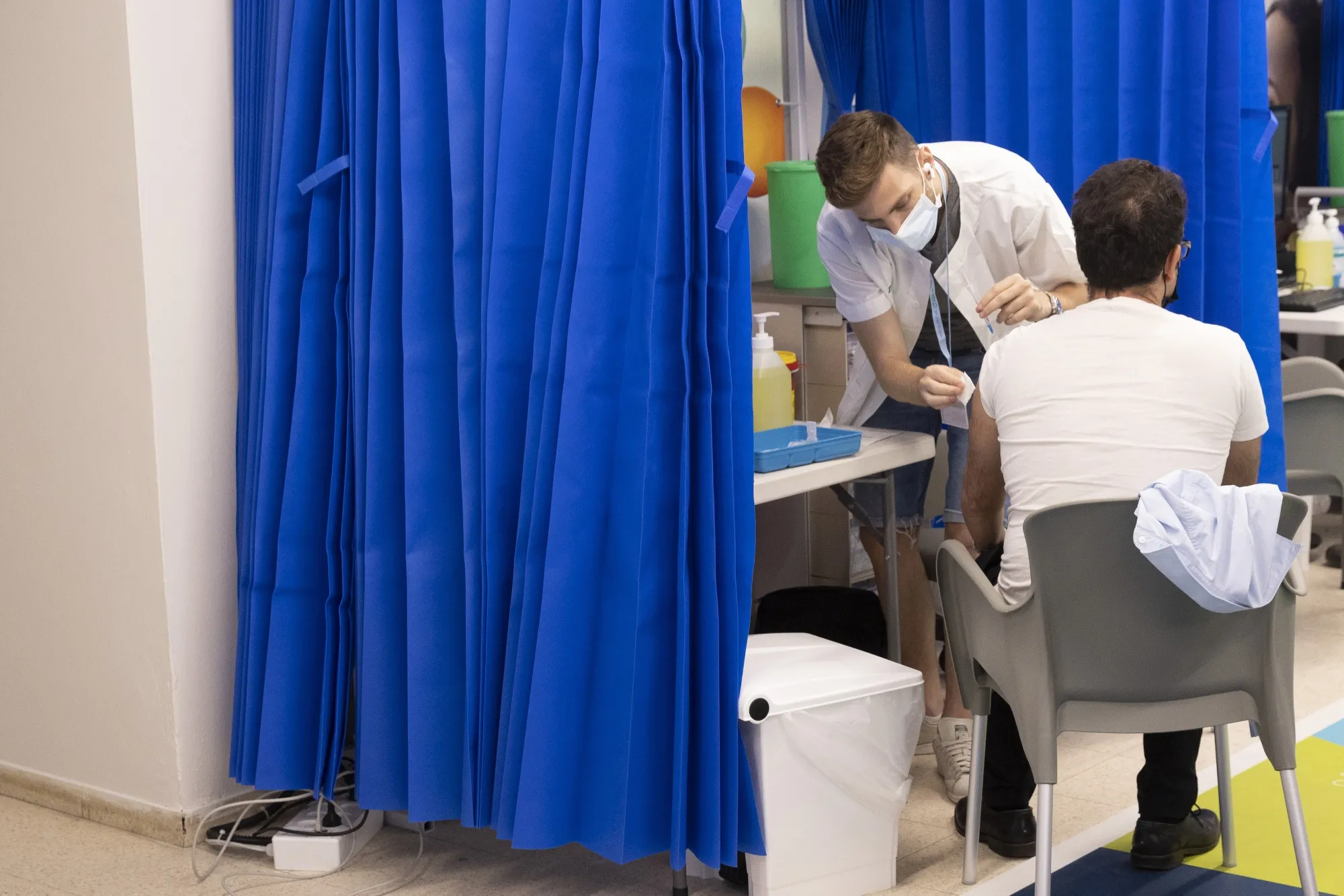 An Israeli resident receives a third dose of the Pfizer vaccine in Tel Aviv, on Aug. 24.