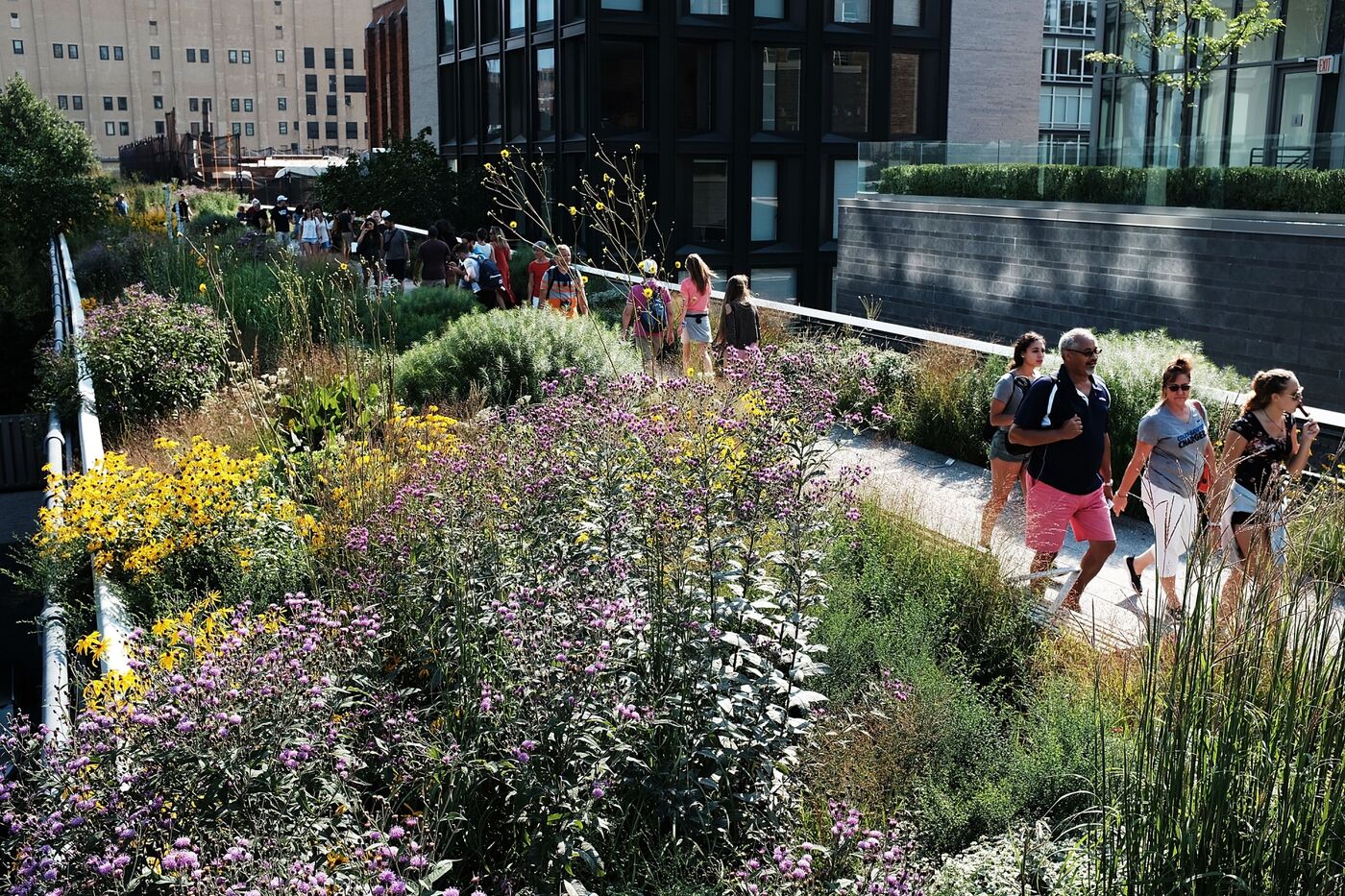 New Yorkers Enjoy High Line Park In 80 Degree Summer Weather