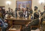 Taliban fighters take control of Afghan presidential palace.