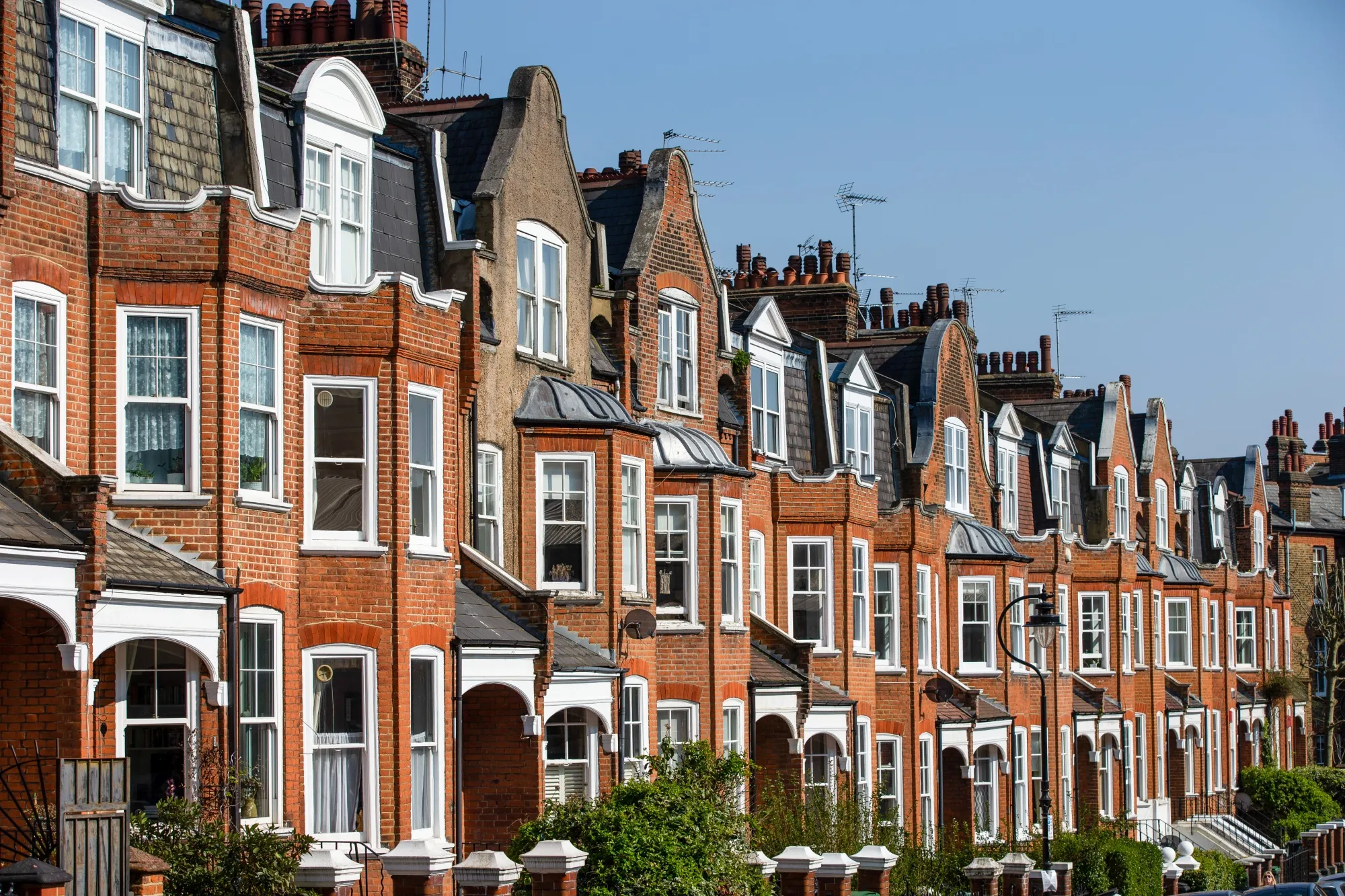 A row of terraced residential properties stands in London, UK.