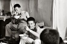 Shan eating in a friend’s dorm while working as a laborer in the Gobi.