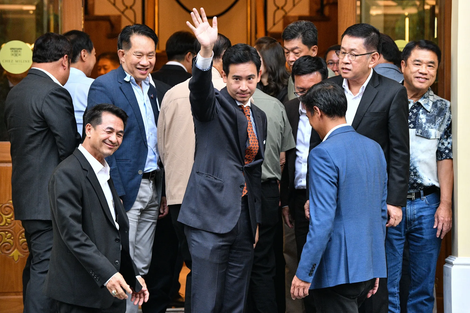 Pita Limjaroenrat, center,  following a meeting with coalition partners in Bangkok, on May 17.