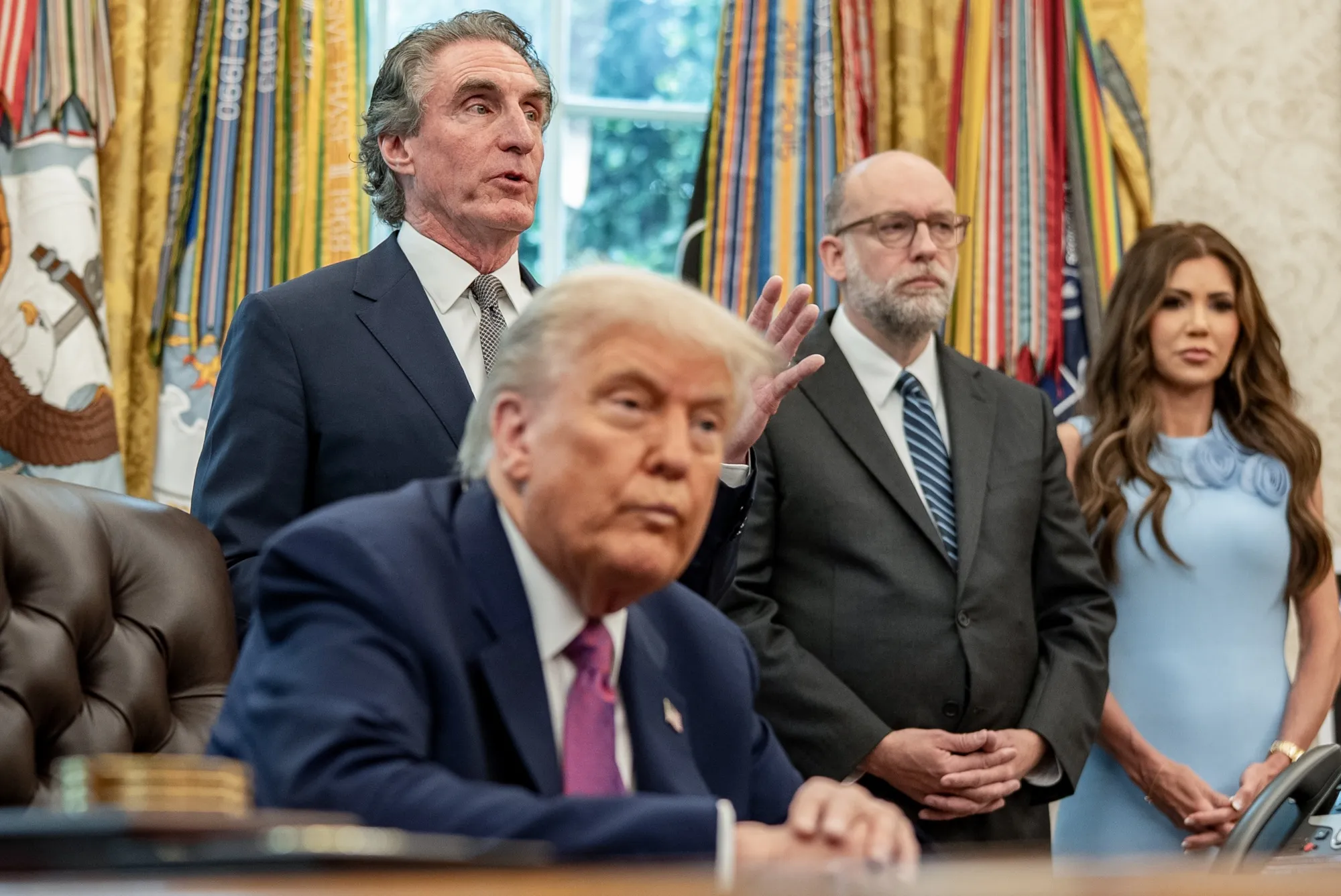 From left, President Donald Trump, Secretary of Interior Doug Burgum, Office of Management and Budget Director Russell Vought and Homeland Security Secretary&nbsp;Kristi Noem at the White House, on June 10.&nbsp;