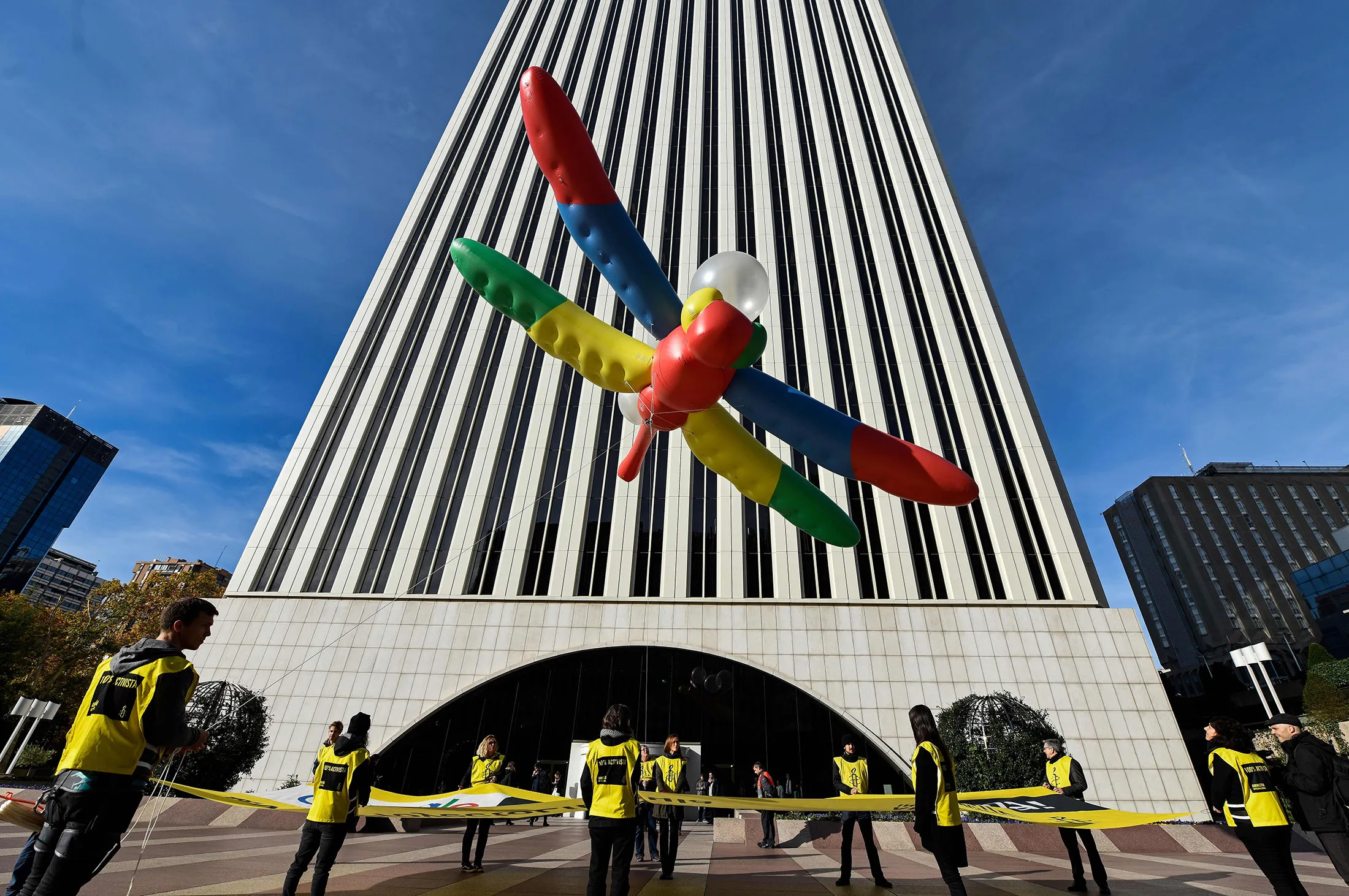 Amnesty International activists hold a giant dragonfly-shaped balloon with a banner reading "Google, do not censor in China, no to the Dragonfly project", outside the Google headquarters in Madrid.&nbsp;