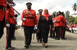 Tanzanian President Samia Hassan inspects a military honor guard following her swearing-in ceremony in Dar es Salaam, Tanzania, on March 19.