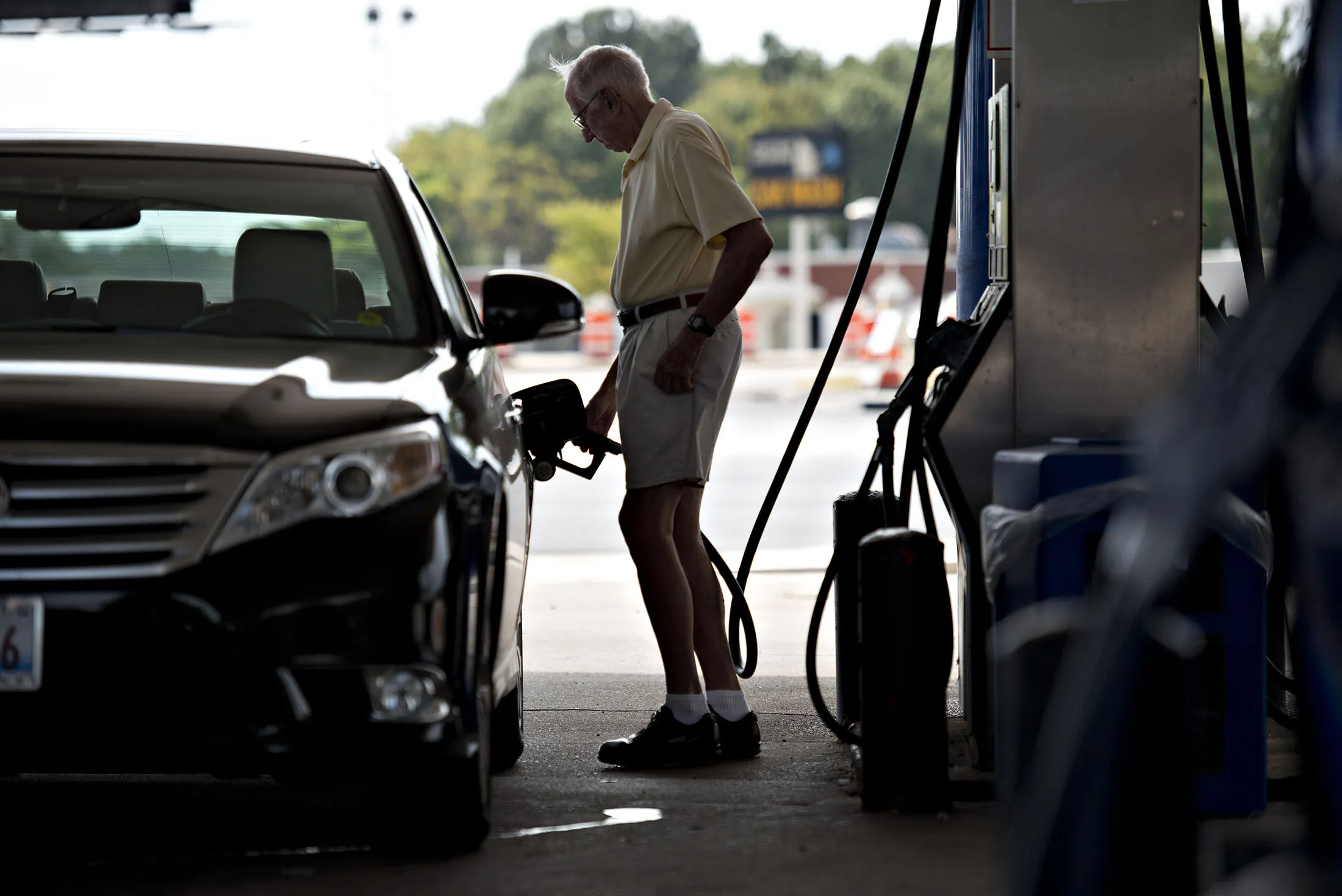 A customer puts fuel in his car at a gas station in Peoria, Illinois, U.S., on Wednesday, Sept. 11, 2013. Gasoline climbed in New York trading as crude advanced before talks between the U.S. and Russia over disposing of Syria’s chemical weapons and as U.S. jobless claims dropped.
