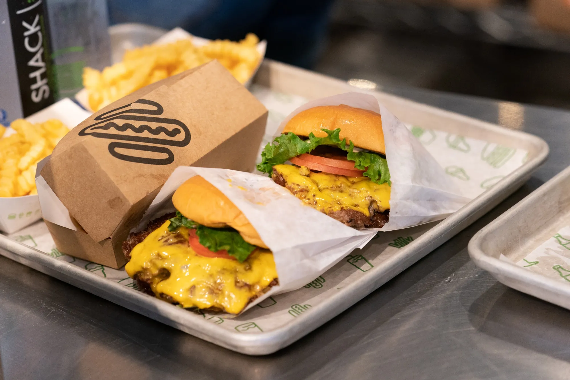 Burgers and fries at a Shake Shack restaurant.