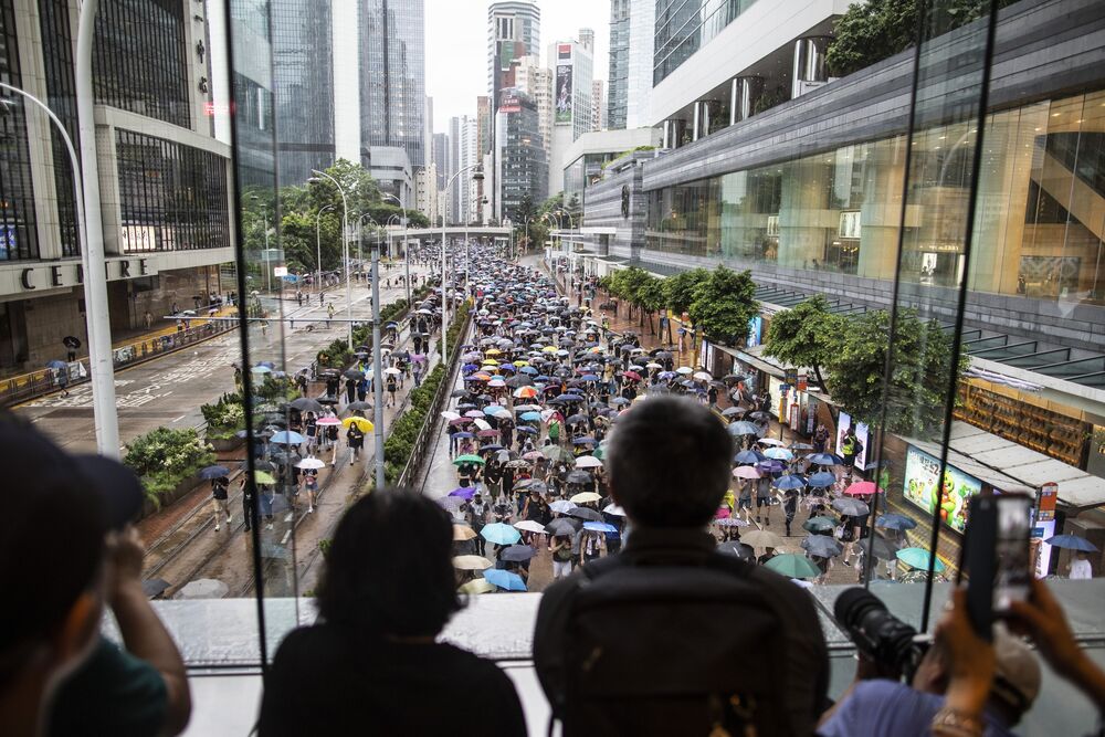 Demonstrators march during a protest in Hong Kong, on Aug. 18.