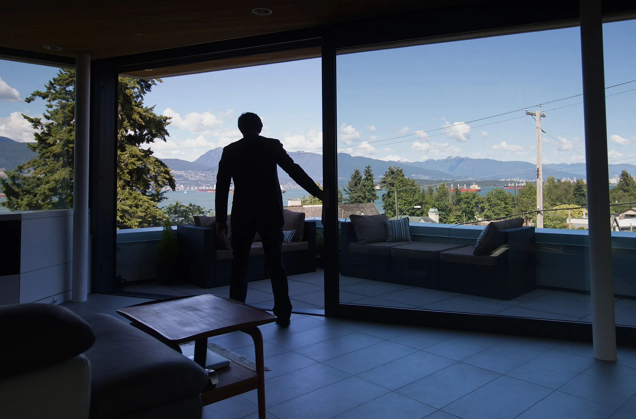 Realtor Lorne Goldman stands in the master bedroom of a home for sale listed at C$7.89 million in the Point Grey neighborhood of Vancouver, British Columbia, Canada, on Friday, June 17, 2016. Vancouver has long been one of the world's most expensive places to live but price gains have reached a whole new level of intensity this year. Low interest rates, rising immigration, and a surge of foreign moneyparticularly from Chinahave all driven the increases.
