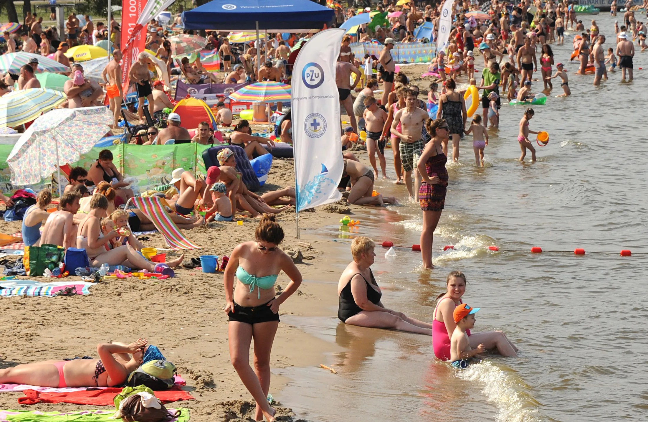 People enjoy a sunny day on the Zalew Zegrzynski lake near Warsaw, Poland, Saturday, Aug 8.
