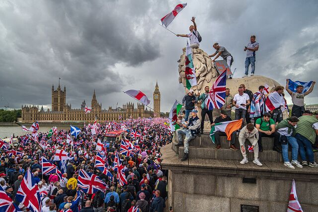 Protesters wave Union flags and St George’s England flags during the “Unite the Kingdom” rally in London on Sept. 13. 