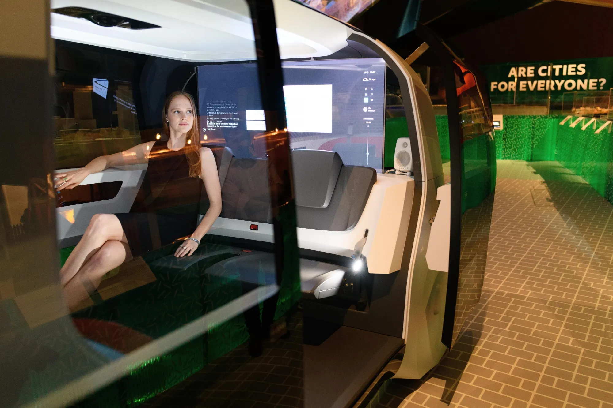 A gallery assistant sits inside a Volkswagen driverless concept car during the press launch of "The Future Starts Here"&nbsp;exhibition&nbsp;at London’s Victoria and Albert Museum in 2018.