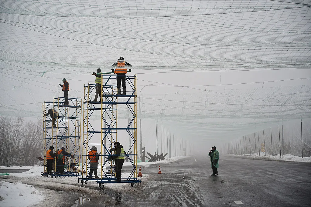 Municipal workers install anti-drone nets in frontline areas to protect critical and social infrastructure, equipment, and military personnel from Russian drone attacks.