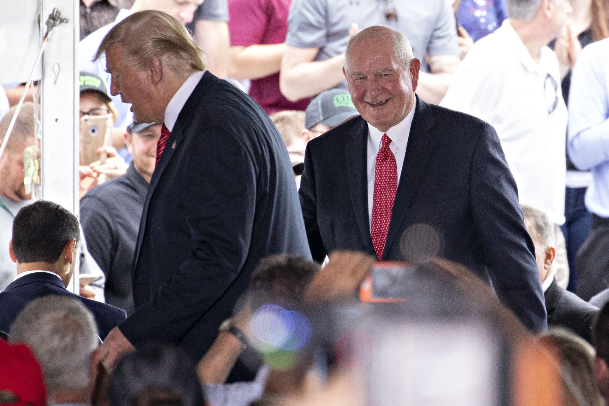 Sonny Perdue, U.S. secretary of agriculture, right, and President Donald Trump at an event&nbsp;in&nbsp;Iowa&nbsp;on&nbsp;June 11.