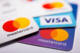 In this photo illustration a Visa credit card and Mastercard