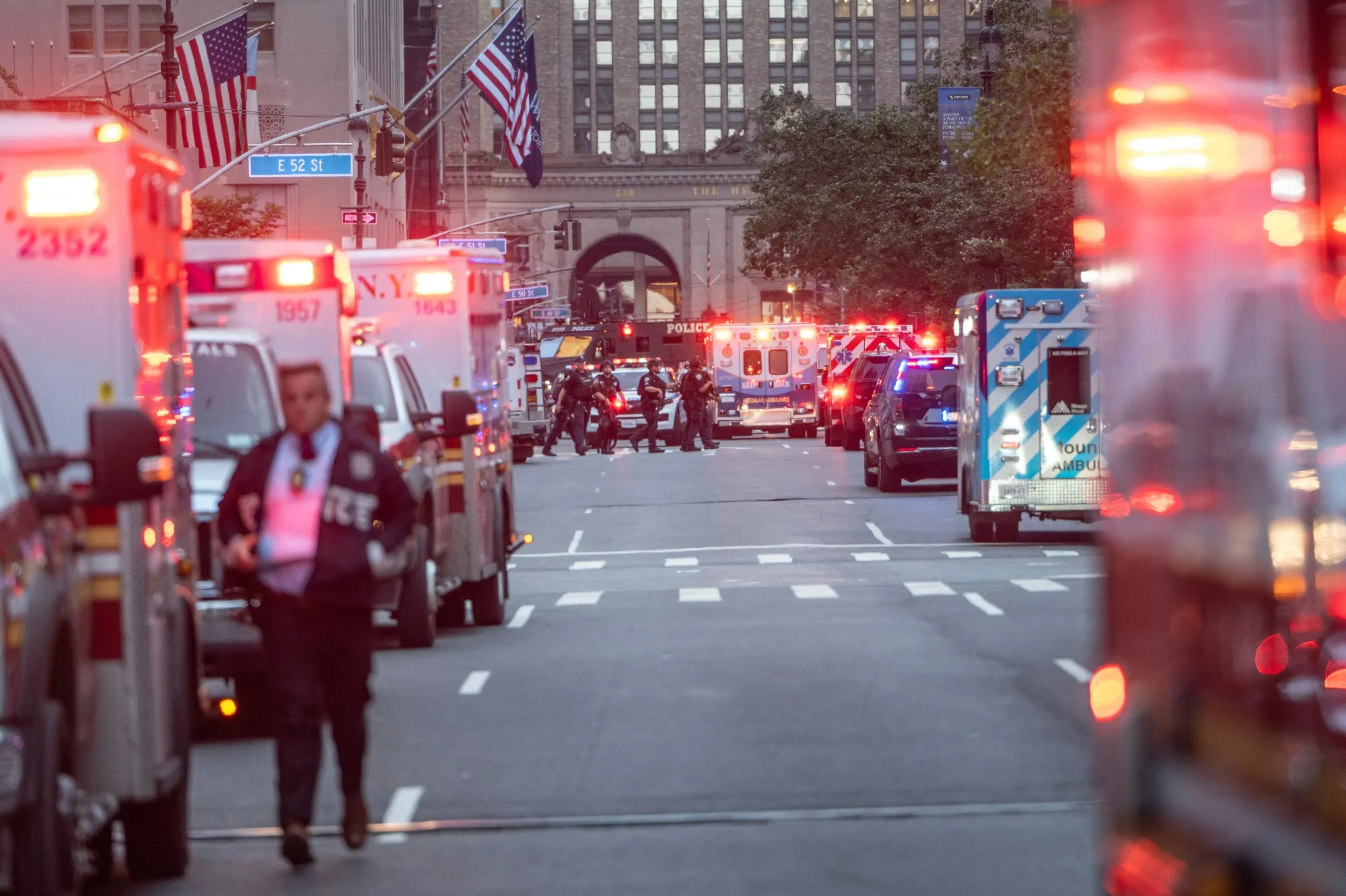 NYPD officers respond to the scene of a shooting in New York on July 28.
