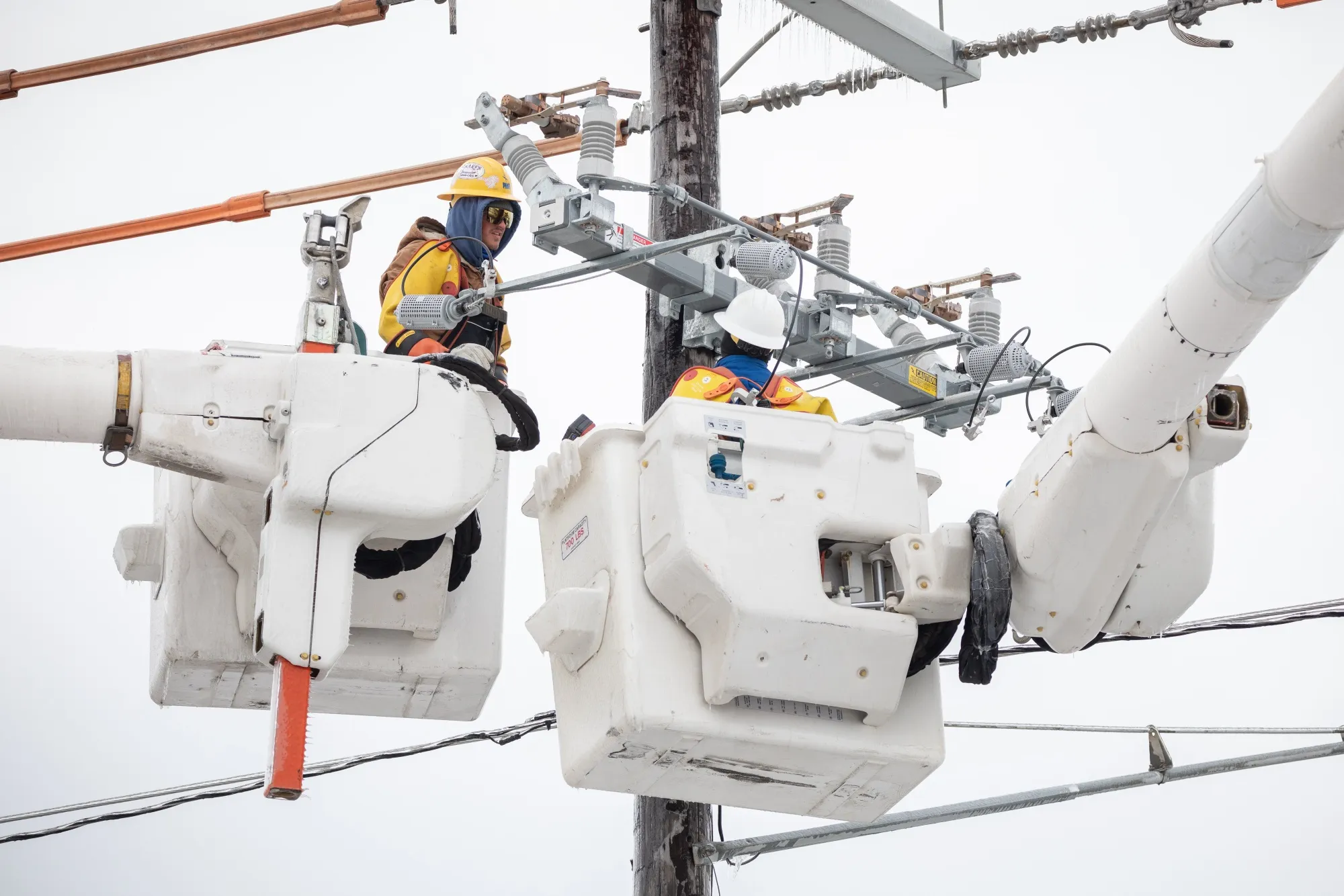 Workers repair a power line in Austin, Texas, on&nbsp;Feb. 18.&nbsp;